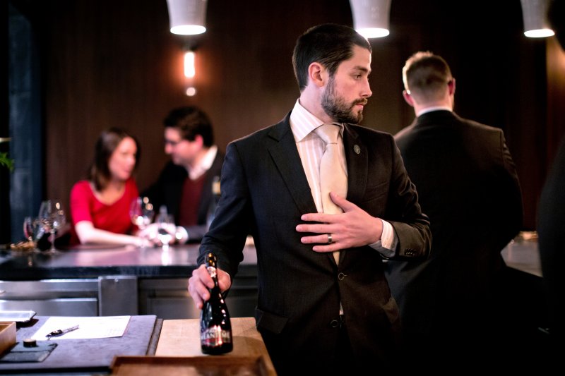 Beverage Director Scott Cameron works a tasting menu service at Atera in New York, NY on Oct. 26, 2013. A matching drink service pairs various alcoholic beverages with each course, and Cameron describes each beverage for the clientele as they are served.