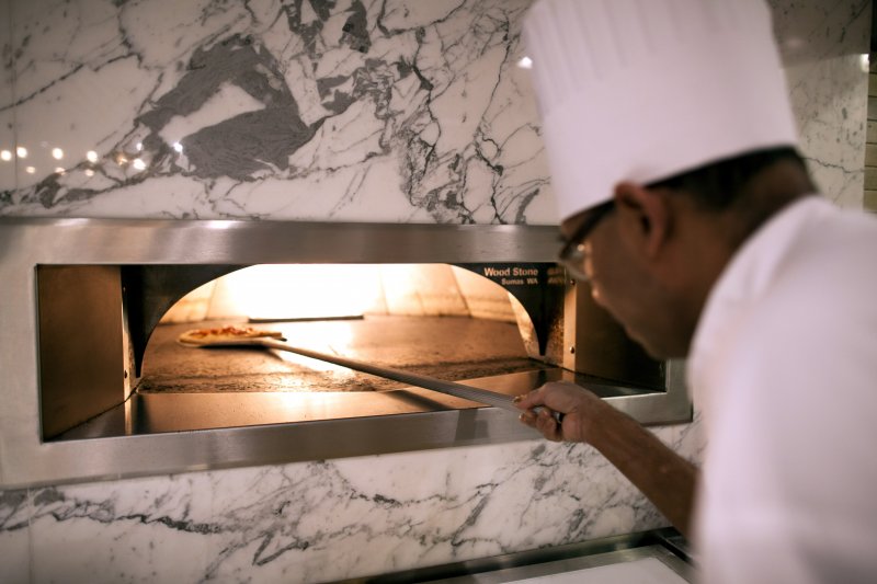 Patrons shop at Herb N' Kitchen, a new dining area at the Hilton Midtown in New York, NY on Sept. 17, 2013. The restaurant, which emphasizes ready-to-go and quickly prepared made-to-order foods, opened in July. 

CREDIT: Brian Harkin for The Wall Street Journal
FIXDECODE_Hilton
