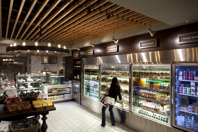 A patron shops at a retail section of at Herb N' Kitchen, a new dining area at the Hilton Midtown in New York, NY on Sept. 17, 2013. The restaurant, which emphasizes ready-to-go and quickly prepared made-to-order foods, opened in July. 

CREDIT: Brian Harkin for The Wall Street Journal
FIXDECODE_Hilton