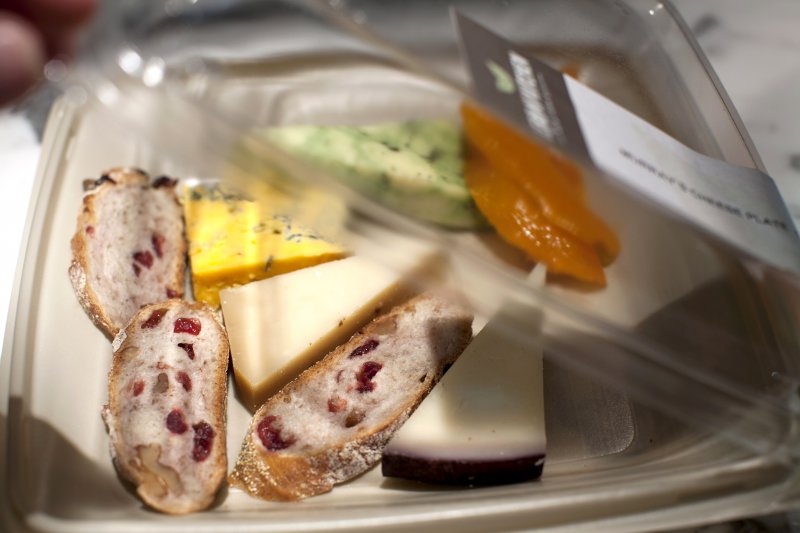 This a cheese plate from Murray's Cheese Shop in a to-go container sold at Herb N' Kitchen, a new dining area at the Hilton Midtown in New York, NY on Sept. 17, 2013. The restaurant, which emphasizes ready-to-go and quickly prepared made-to-order foods, opened in July. 

CREDIT: Brian Harkin for The Wall Street Journal
FIXDECODE_Hilton