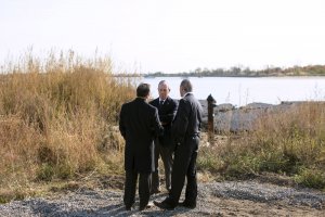 Mayor Michael R. Bloomberg, center, talks with city council members Vincent Ignizio, left, and James S. Oddo while visiting a parks department project to build sand dunes at Crescent Beach in Staten Island, NY on Oct. 29, 2013. Bloomberg visited storm-affected sites in Staten Island, The Rockaways and Coney Island on the anniversary of Hurricane Sandy.