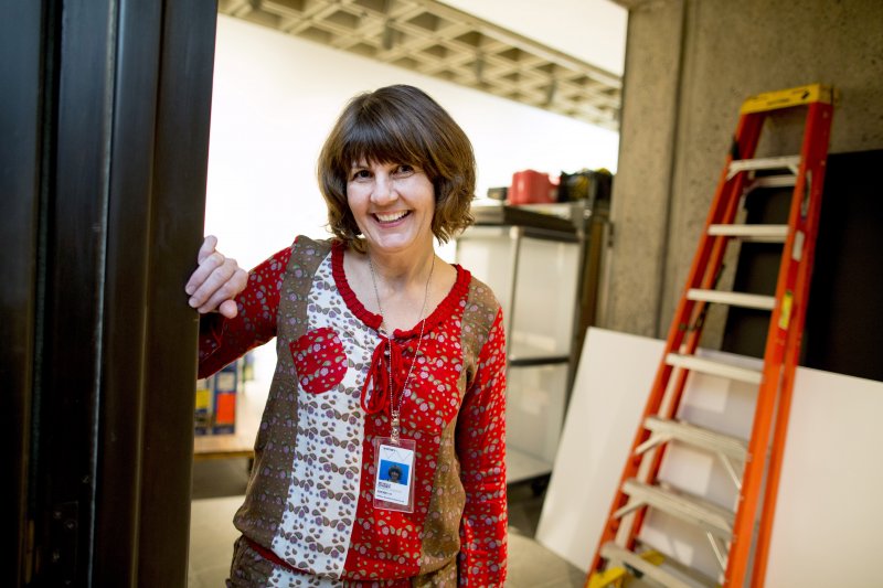 The Chicago-based curator and artist Michelle Grabner poses at the entrance of an exhibition hall where she is setting up artwork at the Whitney Museum of American Art in New York, NY on Feb. 19, 2014. Grabner is one of three curators of the upcoming Whitney Biennial, which opens to the public on March 7.