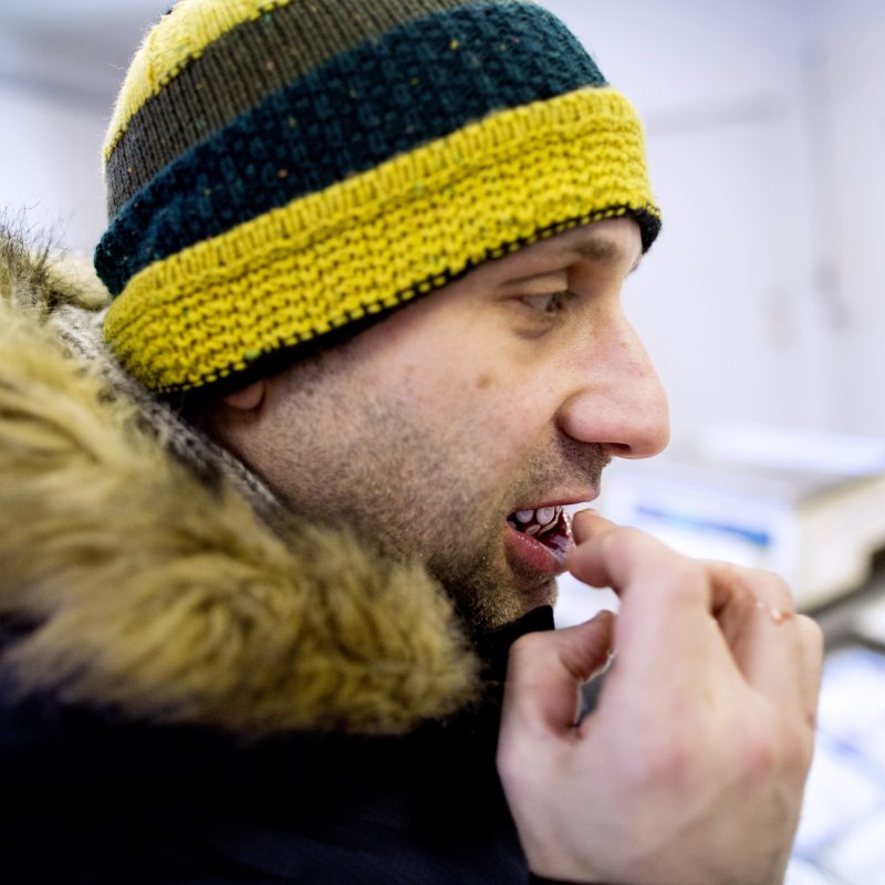 A customer samples octopus at Octopus Garden, an exotic seafood distributor in the Bensonhurst neighborhood of Brooklyn, NY on Dec. 14, 2013. Owner Vincent Cutrone has octopus shipped in from Spain, and he sells to other distributors, restaurants and walk-in customers.